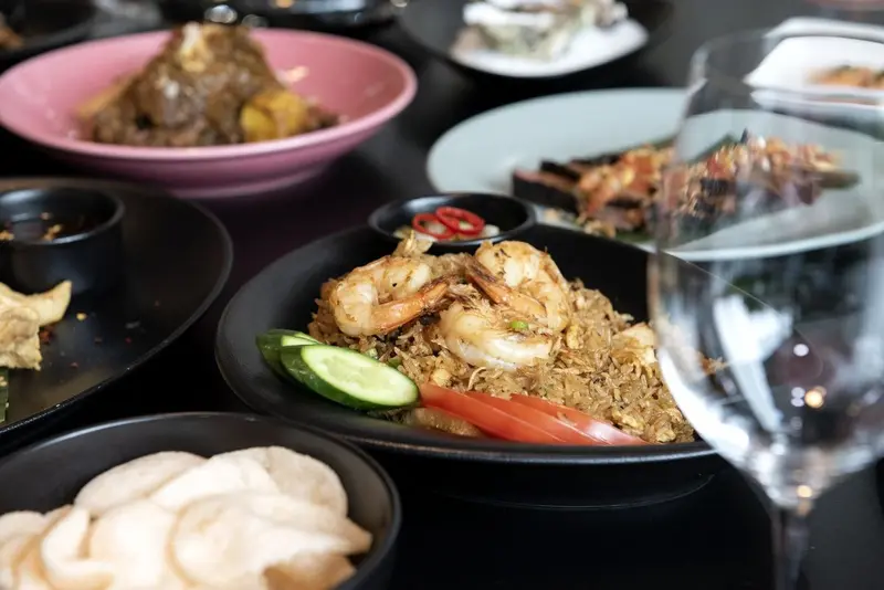 A table of premium Asian takeaway dishes including prawn fried rice from My Bella Asian, a local Bella Vista restaurant
